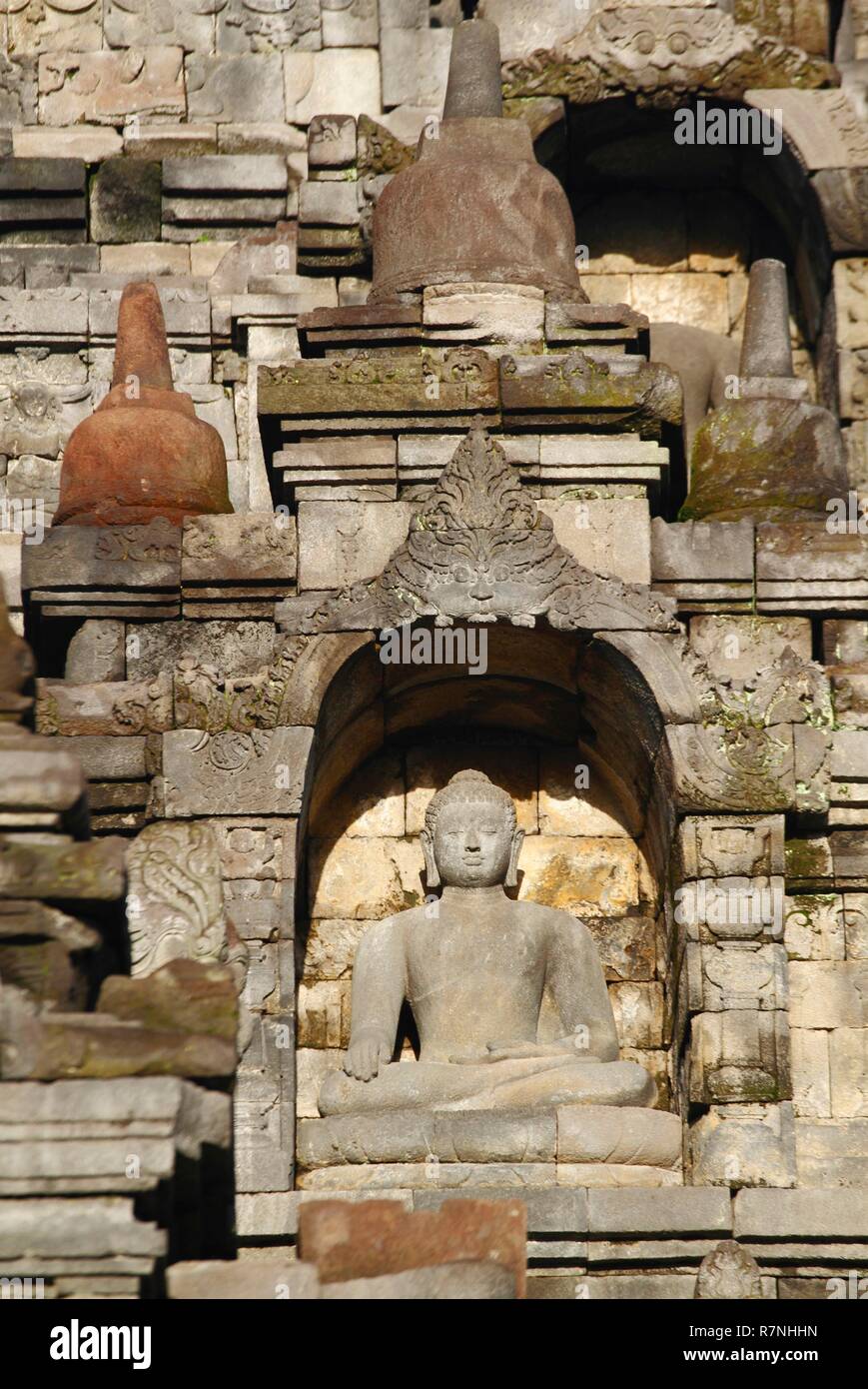Indonesia, Java, Borobudur, Stone carved Buddha statue on the largest