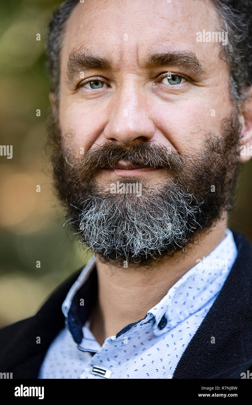 Portrait Of Handsome Mature Man Curly Black And Gray Hair Stock