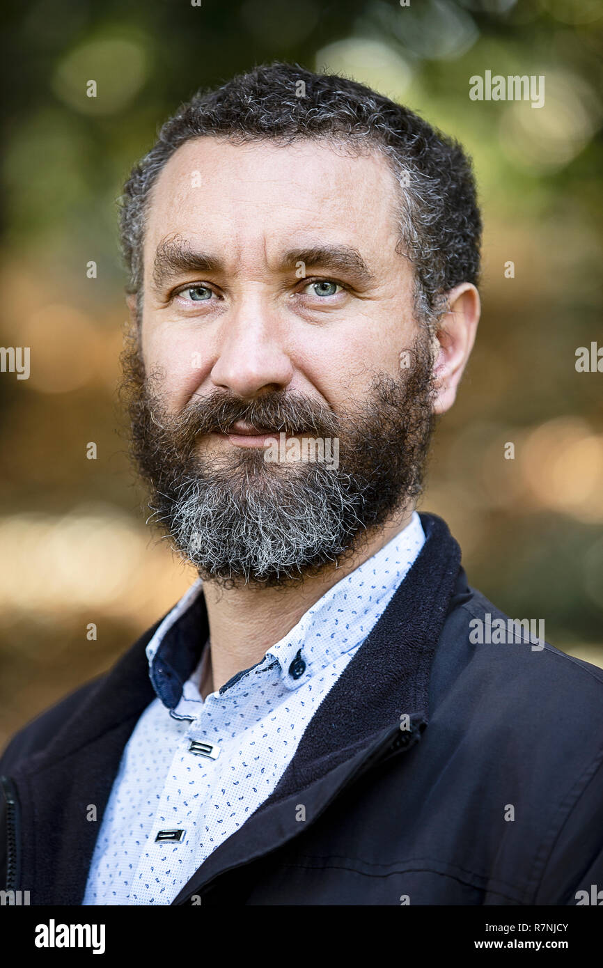 Portrait Of Handsome Mature Man Curly Black And Gray Hair Stock Photo Alamy