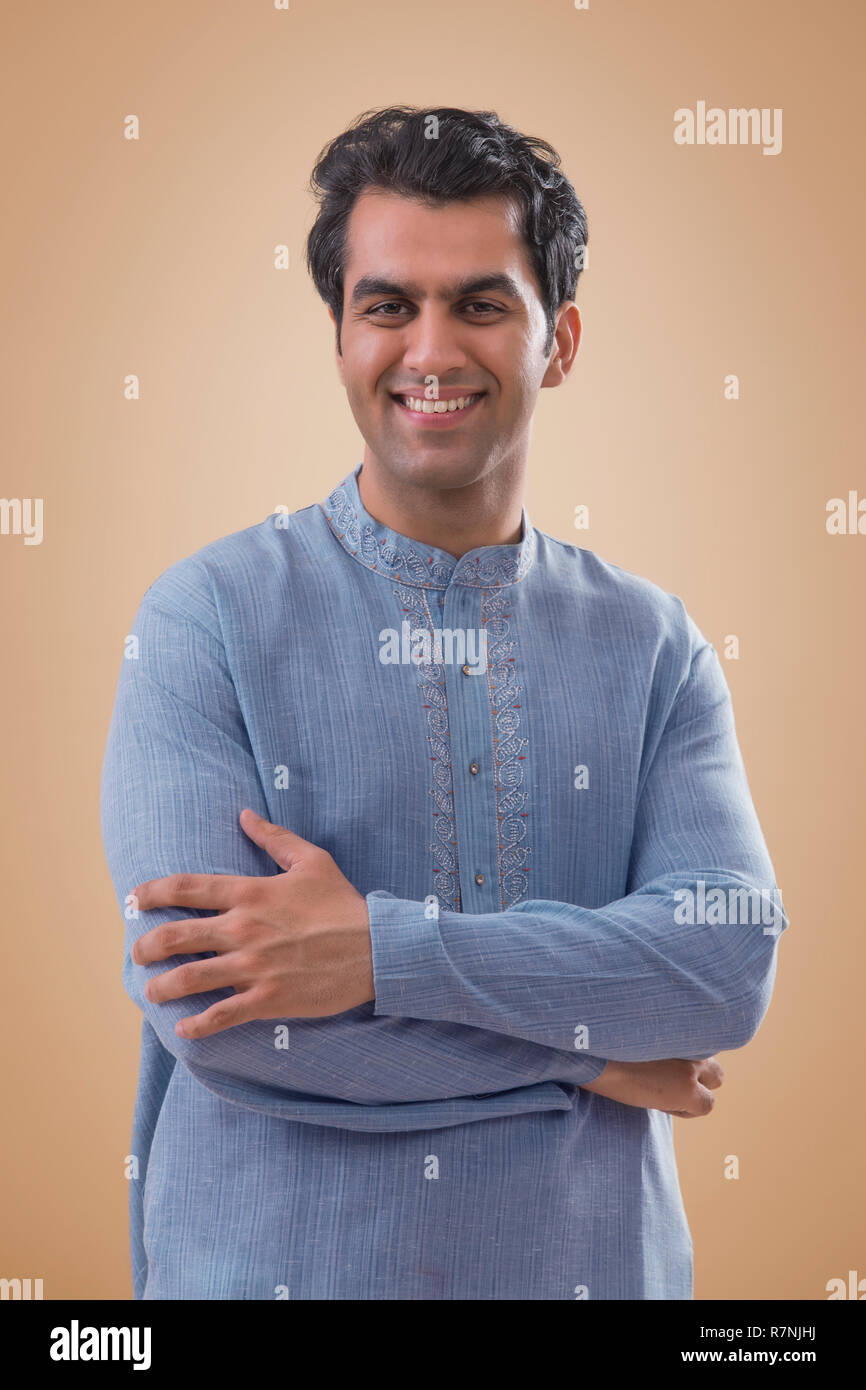 Indian young man standing arms hi-res stock photography and images - Alamy