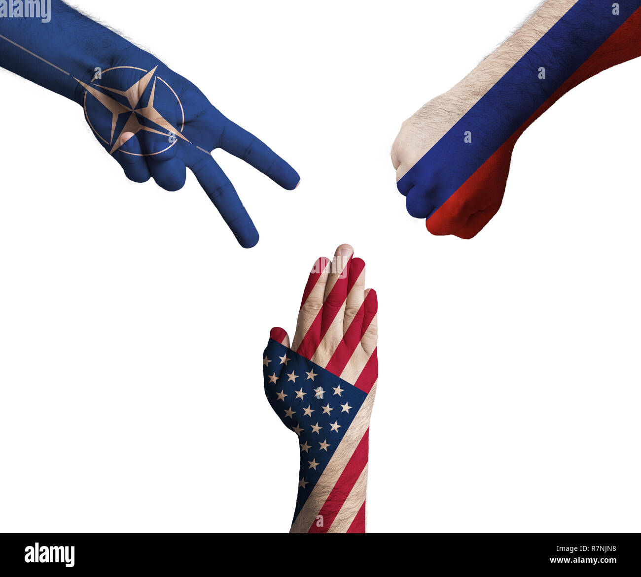 hands decorated in flags of European Union, United States of America and Russian Federation showing Scissors, paper, stone - symbolizing the difficult Stock Photo