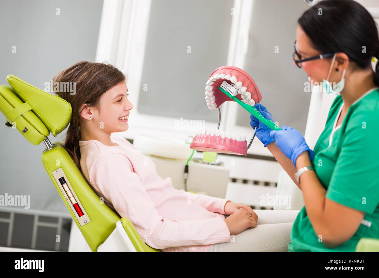 Dentist Is Teaching Little Girl About Oral Hygiene Stock Photo