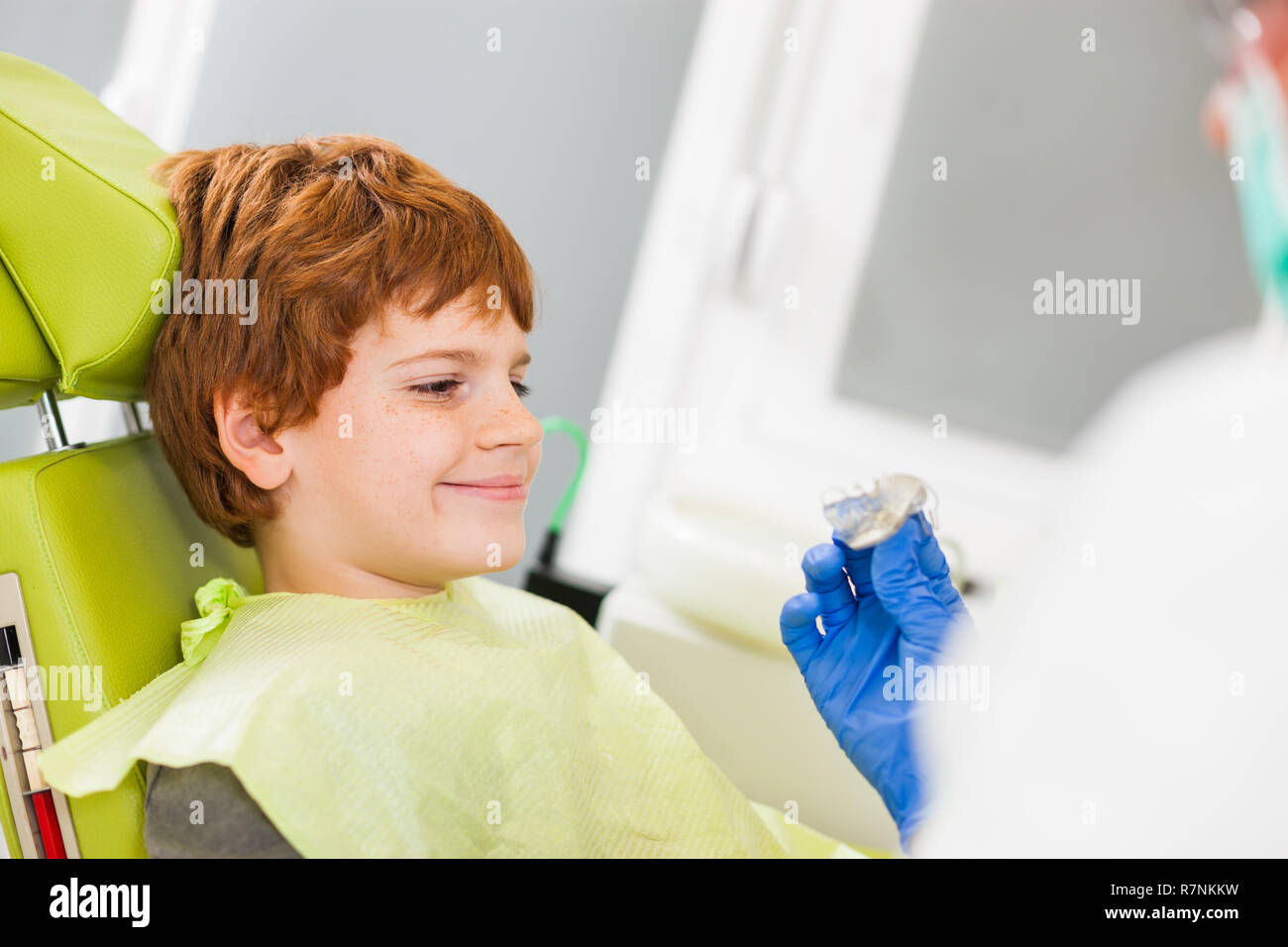 Dentist is teaching little boy about braces Stock Photo Alamy
