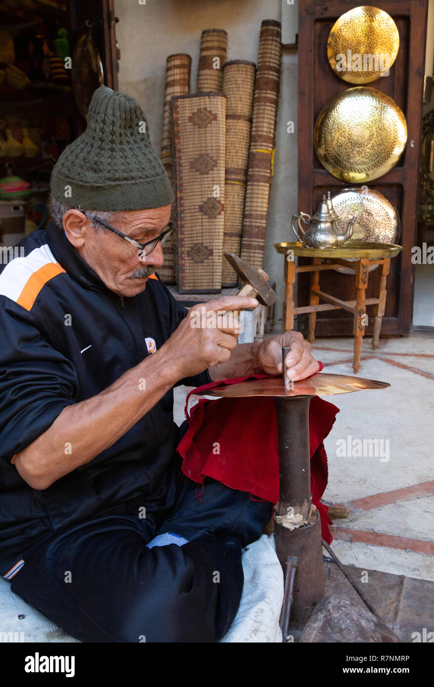 Marrakech craftsman - metalworker working in the souk, Marrakesh medina, Morocco North Africa Stock Photo