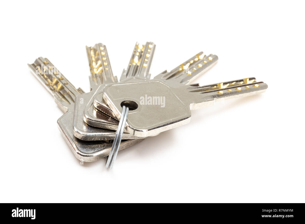 Five security keys on ring isolated on white Stock Photo