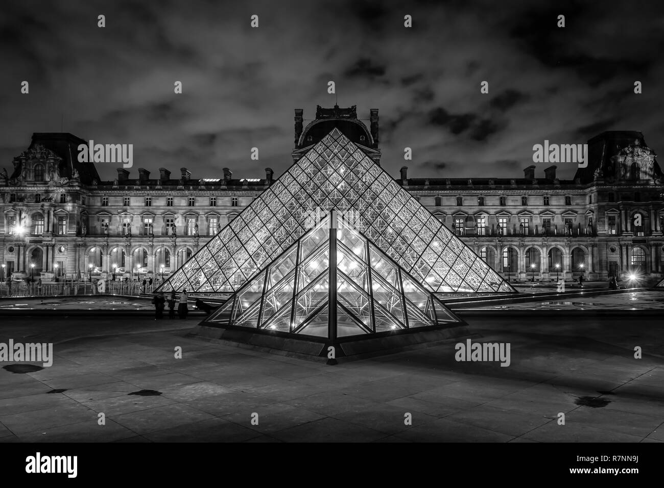 The Louvre Pyramid at night, Paris, France Stock Photo