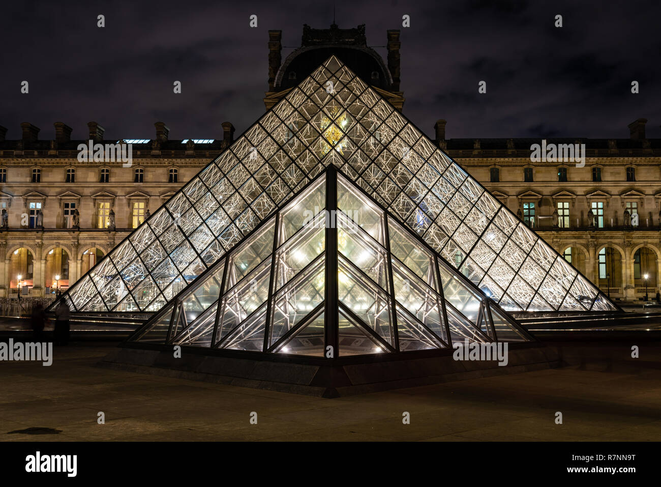 The Louvre Pyramid at night, Paris, France Stock Photo