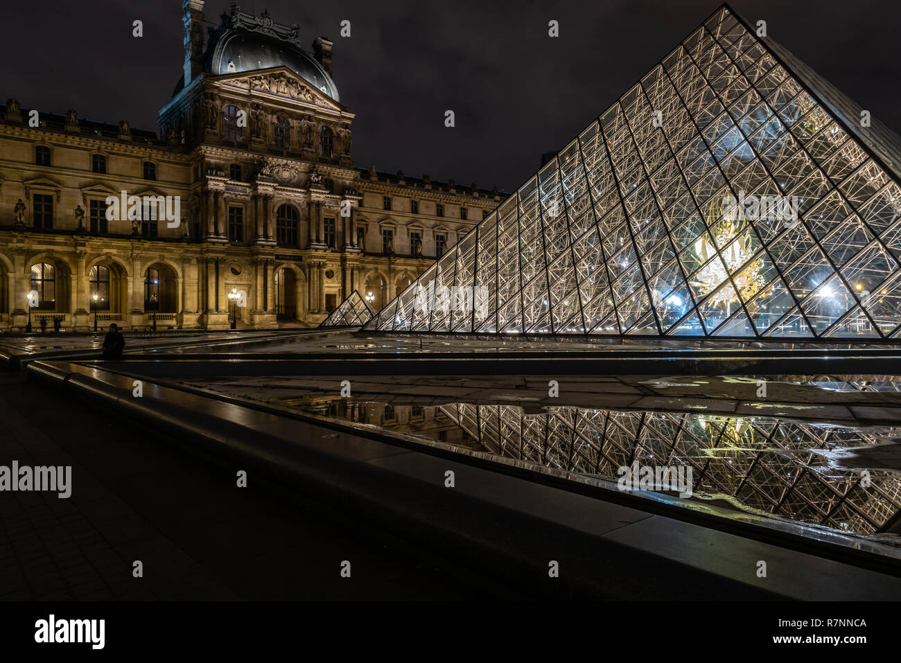 The Louvre Pyramid at night, Paris, France Stock Photo