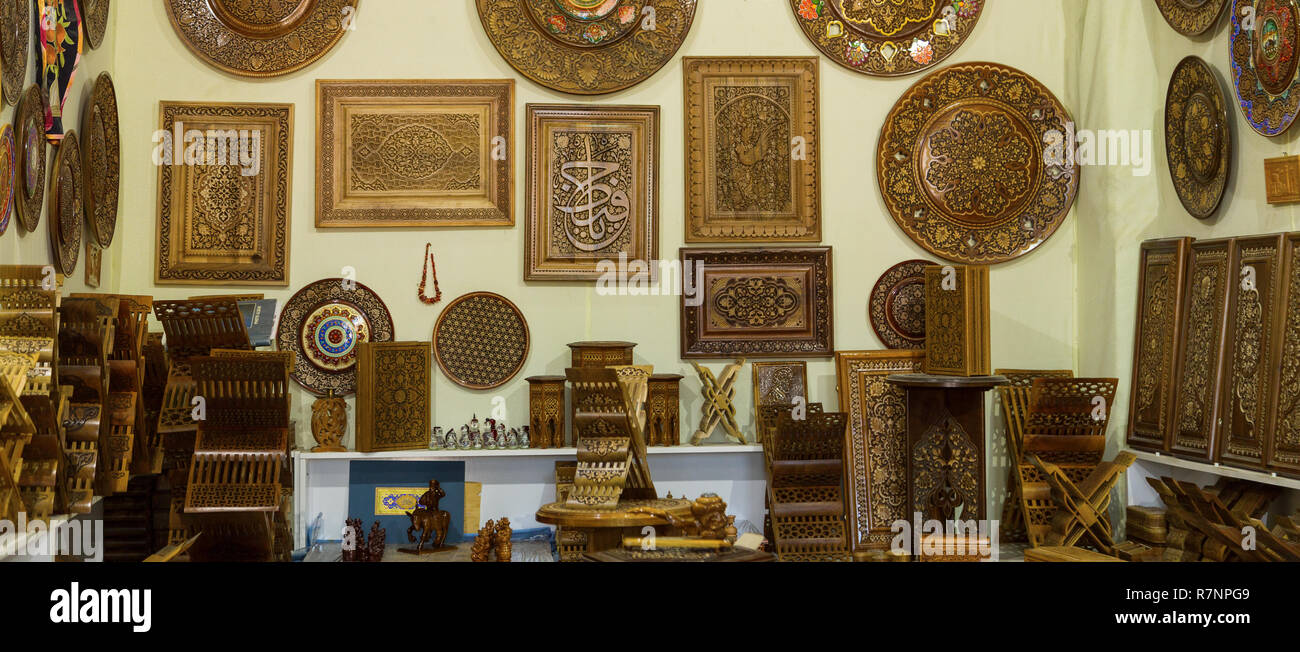 Store of ingenious rihals. Wooden book stands in Bukhara, Uzbekistan. Holly Quran Kuran Koran book holder stands shop. Beautiful works of art, carved  Stock Photo