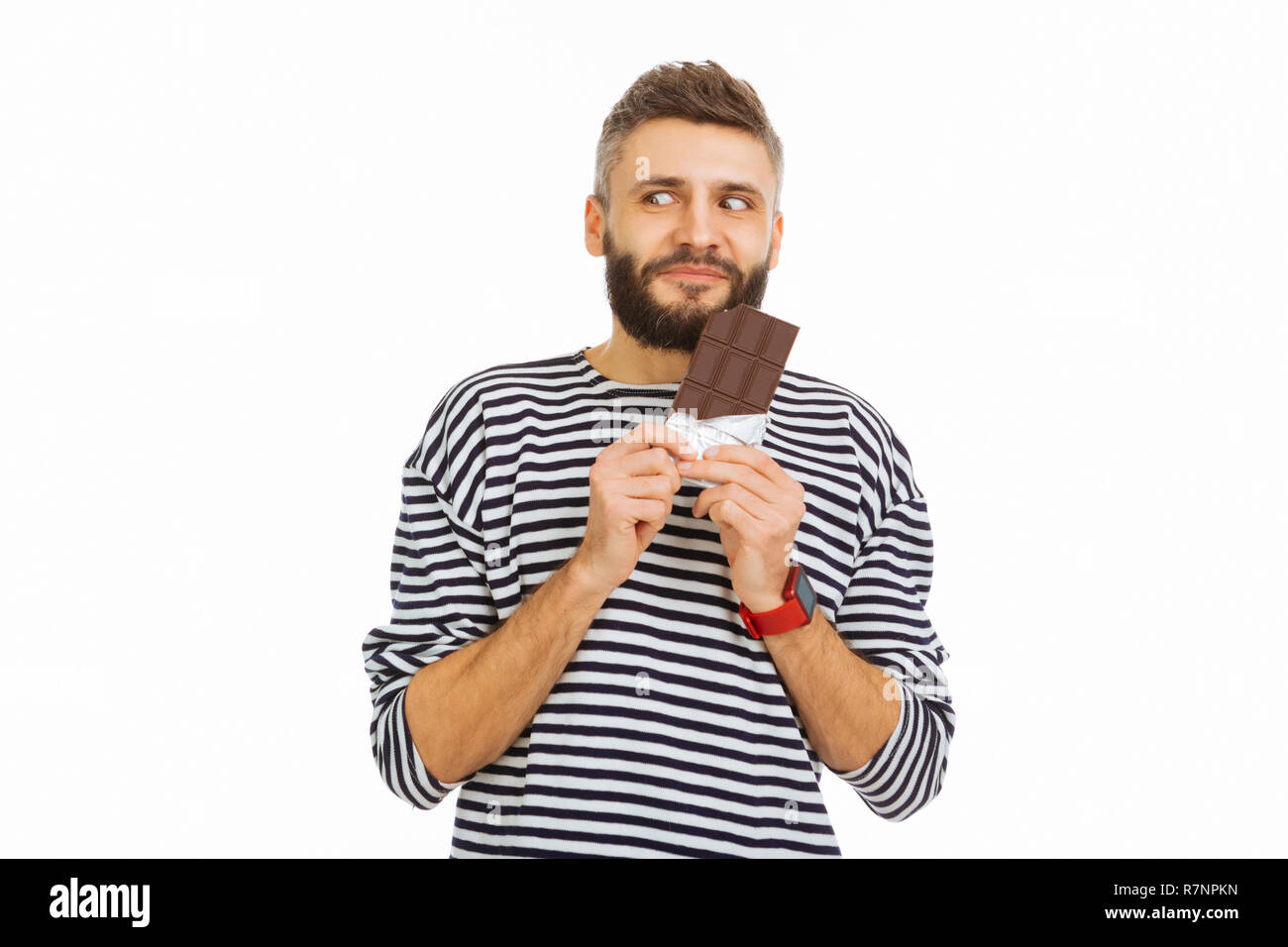 Happy nice man wanting to eat chocolate Stock Photo