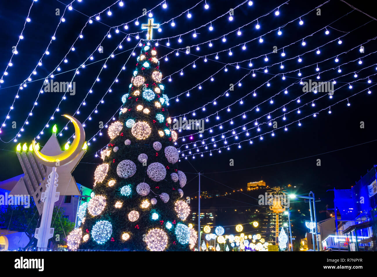 Haifa, Israel - December 1, 2018 : Three religions light ornaments in The German Colony decoration for the holidays, in Haifa, Israel Stock Photo