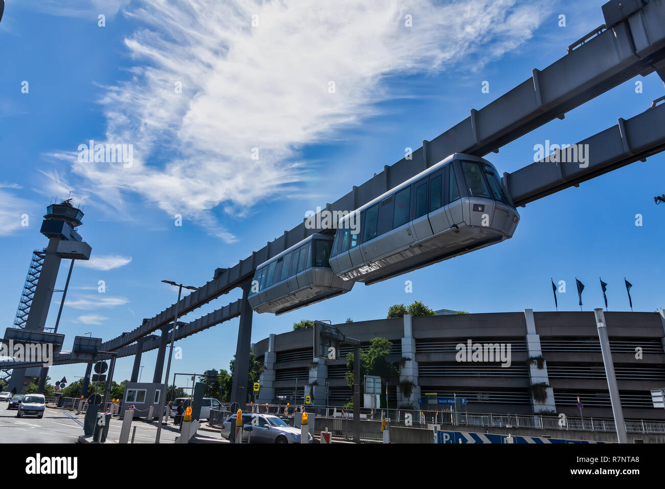 Dusseldorf, Germany - July 3, 2018: Public transportation system Sky-Train hanging from elevated guideway beam on columns in Dusseldorf, Germany. The  Stock Photo