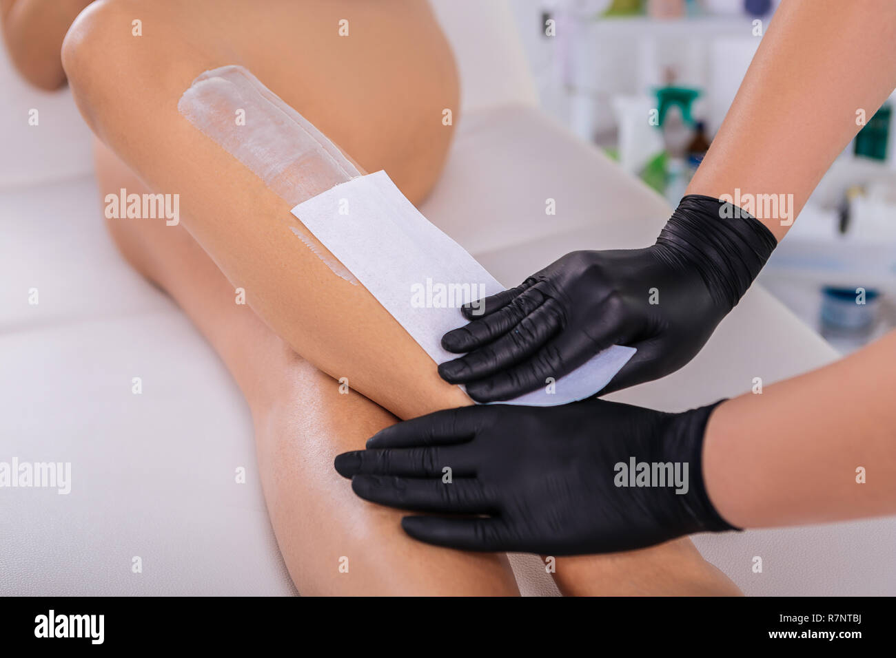 Businesswoman with long legs visiting her depilation master Stock Photo