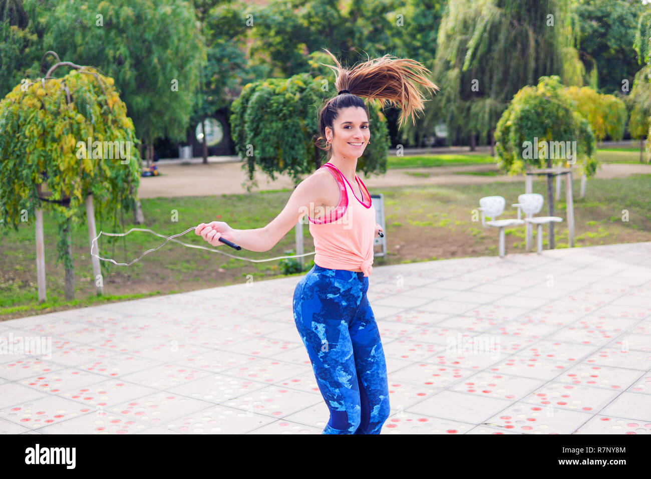 Young woman doing jump rope hi-res stock photography and images - Alamy