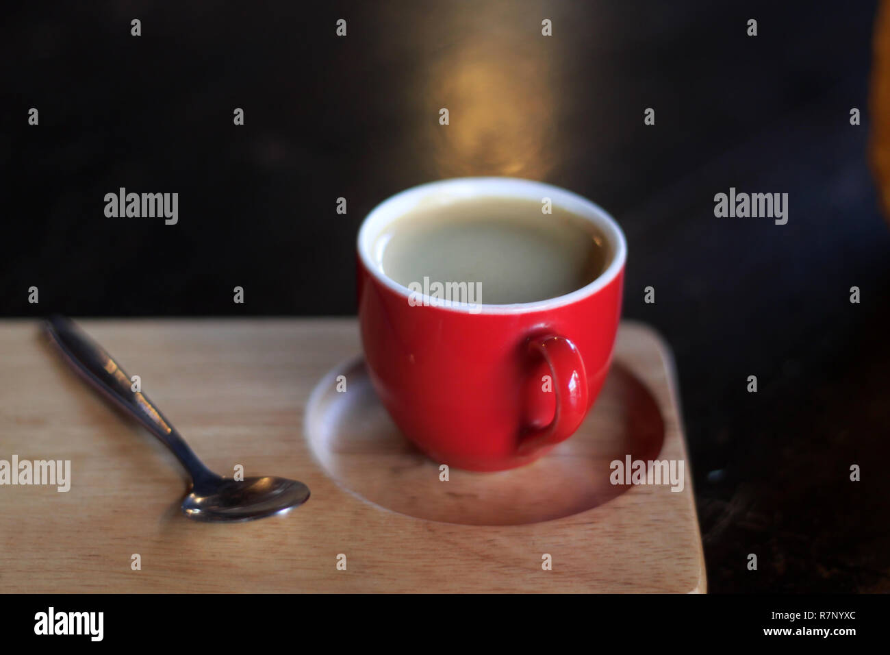 Red cup of coffee on wooden tray Stock Photo