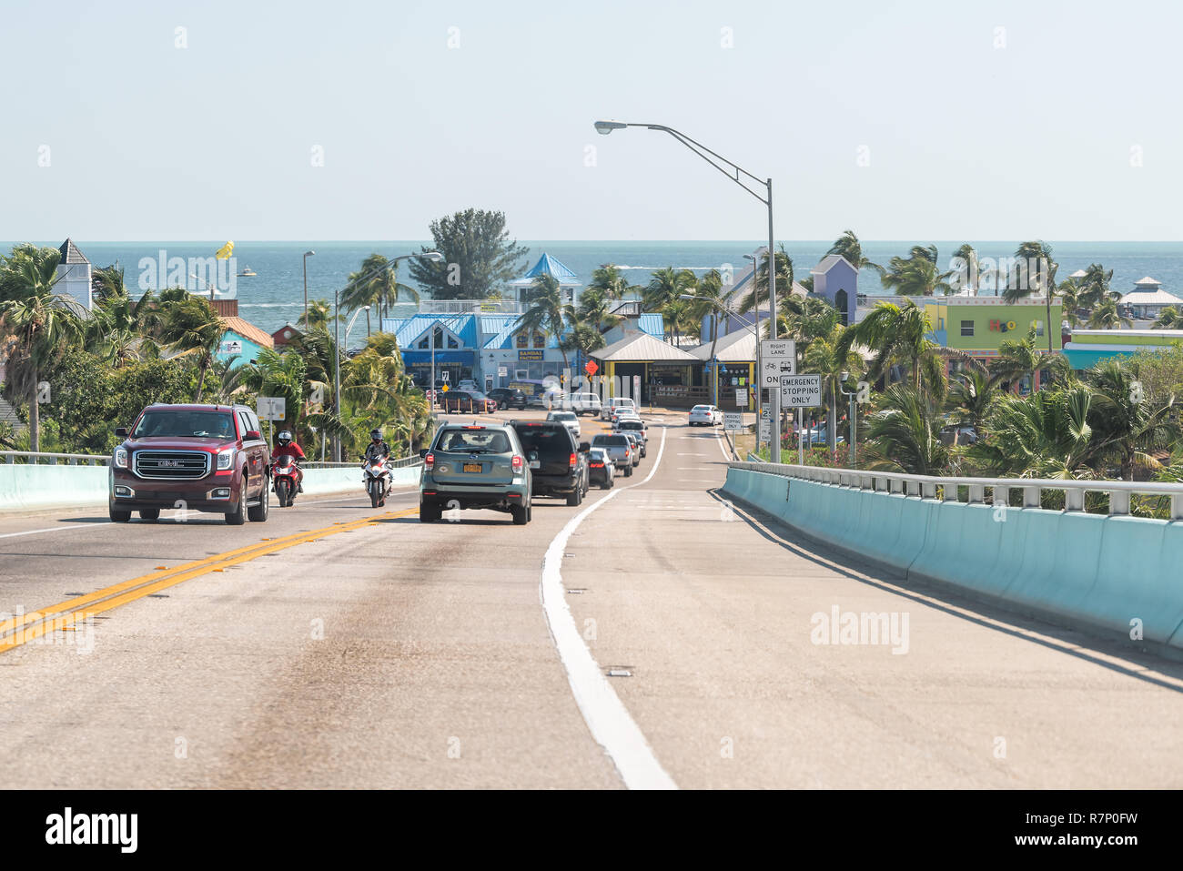 Fort Myers Beach, USA - April 29, 2018: Sunny day with Matanzas Pass Bridge highway road and cars traffic, in holiday vacation destination, high angle Stock Photo