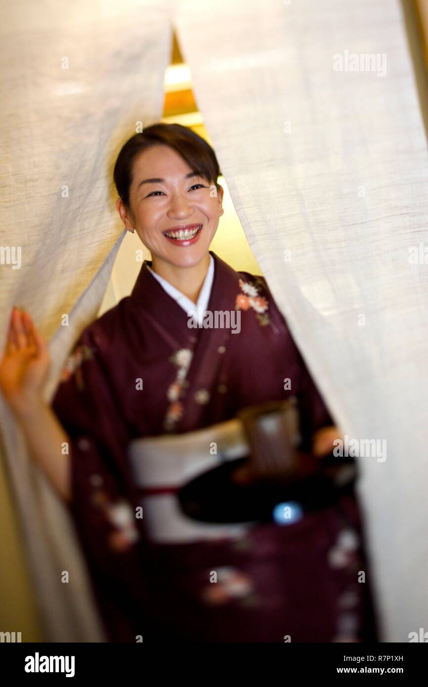 France, Paris, Japanese restaurant Okuda, waitress in traditional dress