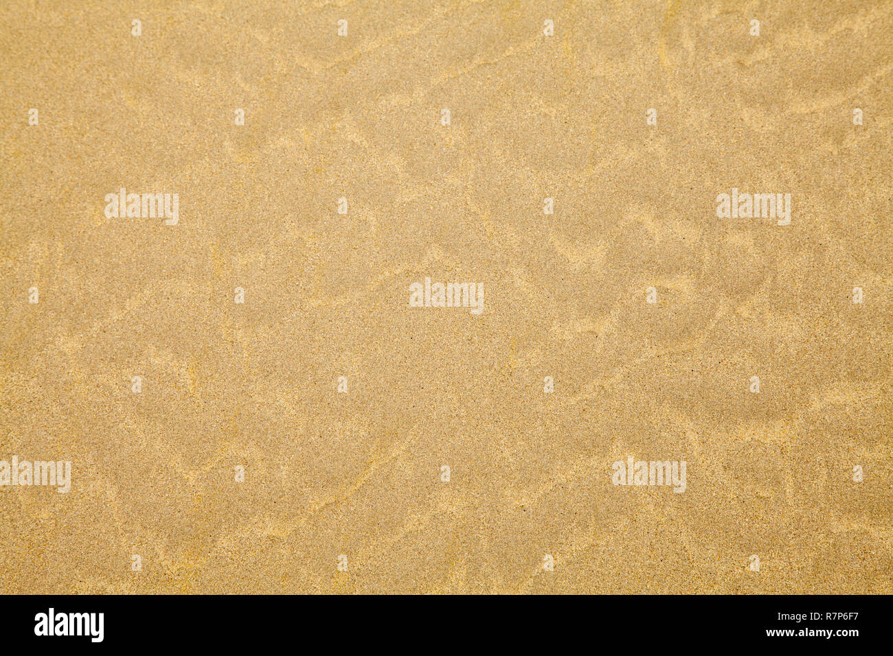 Tan Beach Sand With Ripple Pattern Background. Stock Photo