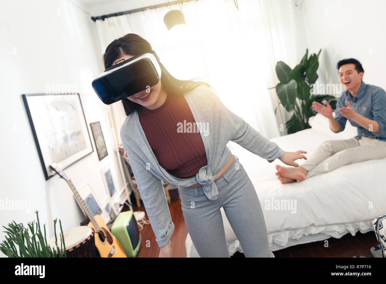 Happy couples playing indoors Stock Photo Alamy