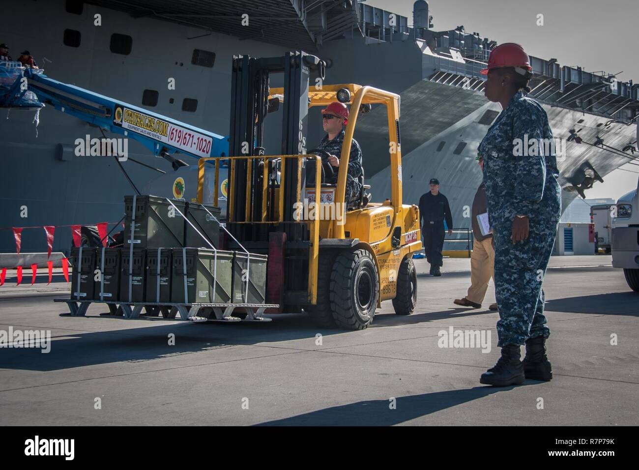 San Diego Mar 28 2017 A Sailor Uses A Forklift To Transport Ammunition On The Pier