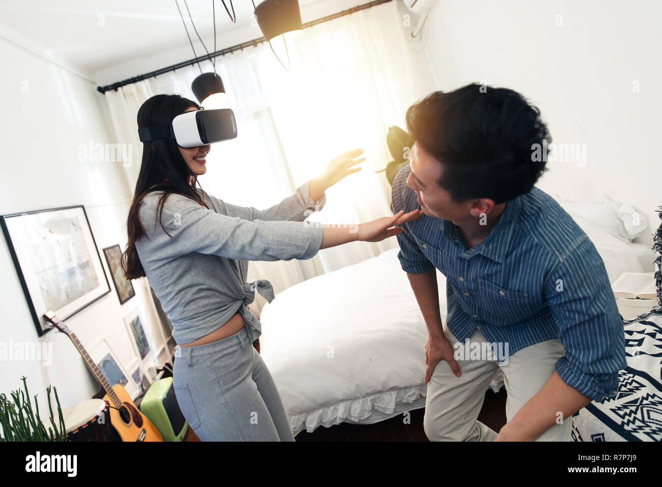 Happy couples playing indoors Stock Photo Alamy
