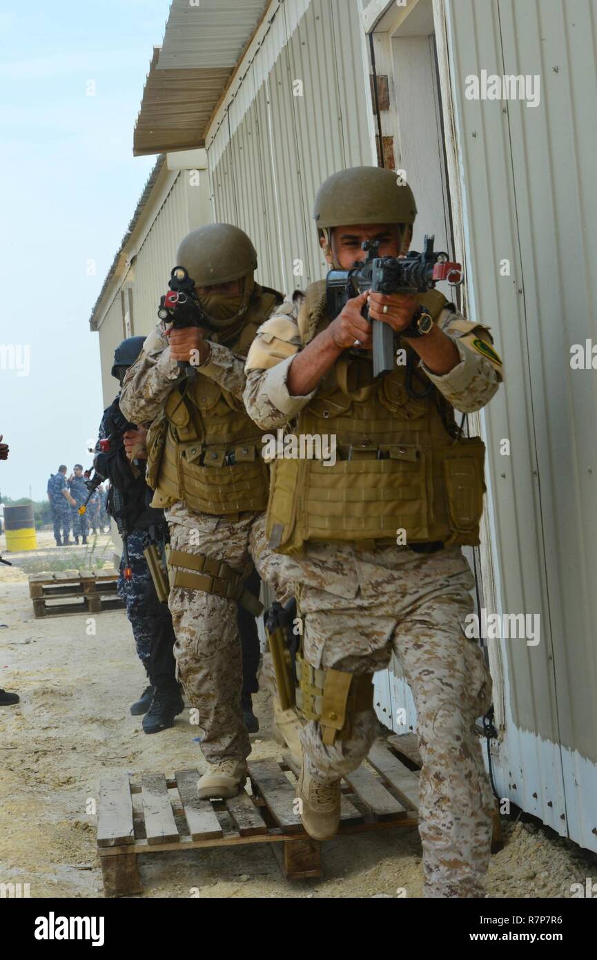 Search and Rescue Eagle Resolve 2017  -  Civilian and military personnel from Kuwait, Qatar, Saudi Arabia and the U.S. conduct counterterrorism drills, search and rescue operations and respond to a mock vehicle explosion as part of exercise Eagle Resolve, March 28, 2017, in Kuwait. The training exercises participant’s ability to respond as a combined joint task force headquarters staff. Exercise Eagle Resolve is the premier U.S. multilateral exercise within the Arabian Peninsula. Since 1999, Eagle Resolve has become the leading engagement between the U.S. and Gulf Cooperation Council nations t Stock Photo