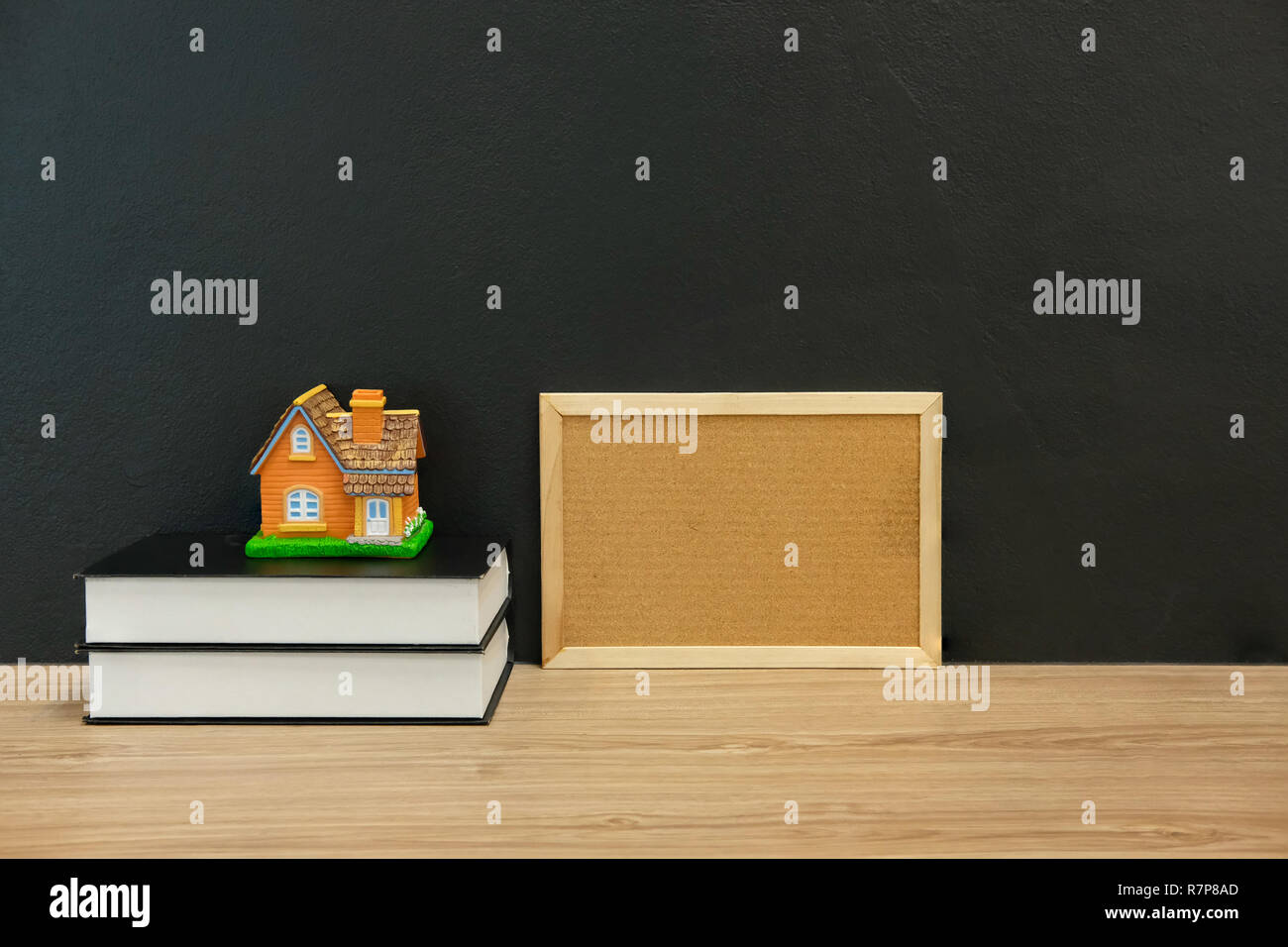 house home model cork board book on wooden desk. real estate property law Stock Photo