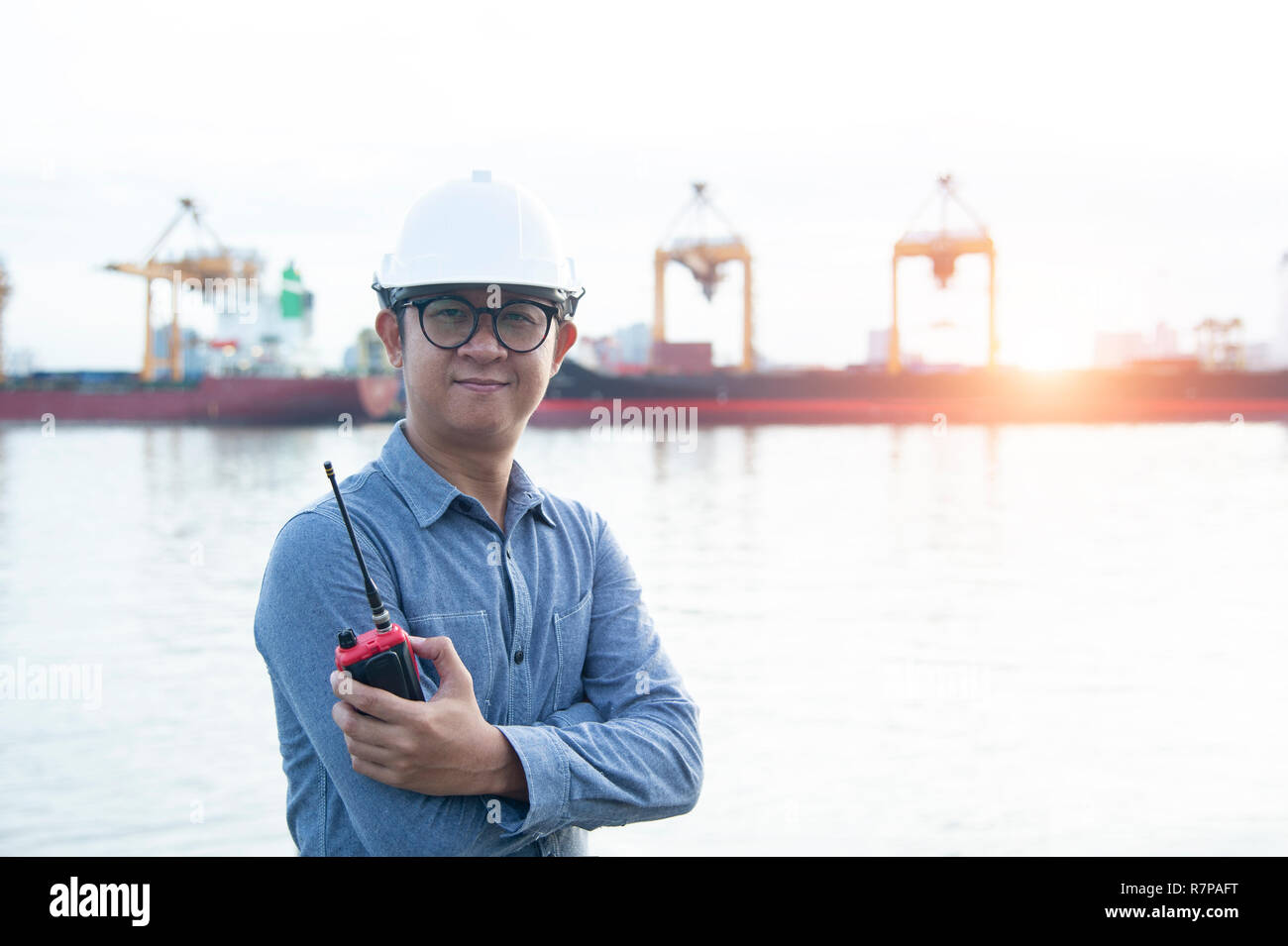 engineer standing a happy in front of  port Stock Photo