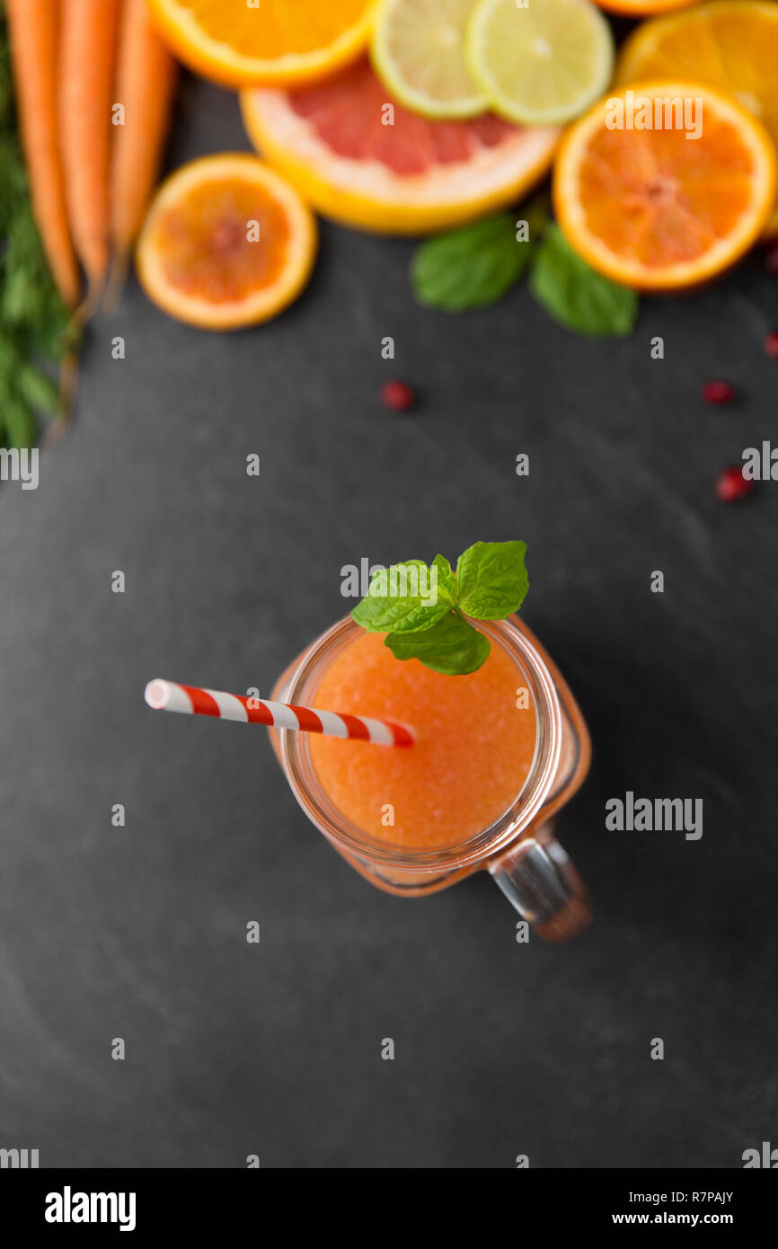 mason jar glass of fruit juice on slate table top Stock Photo Alamy