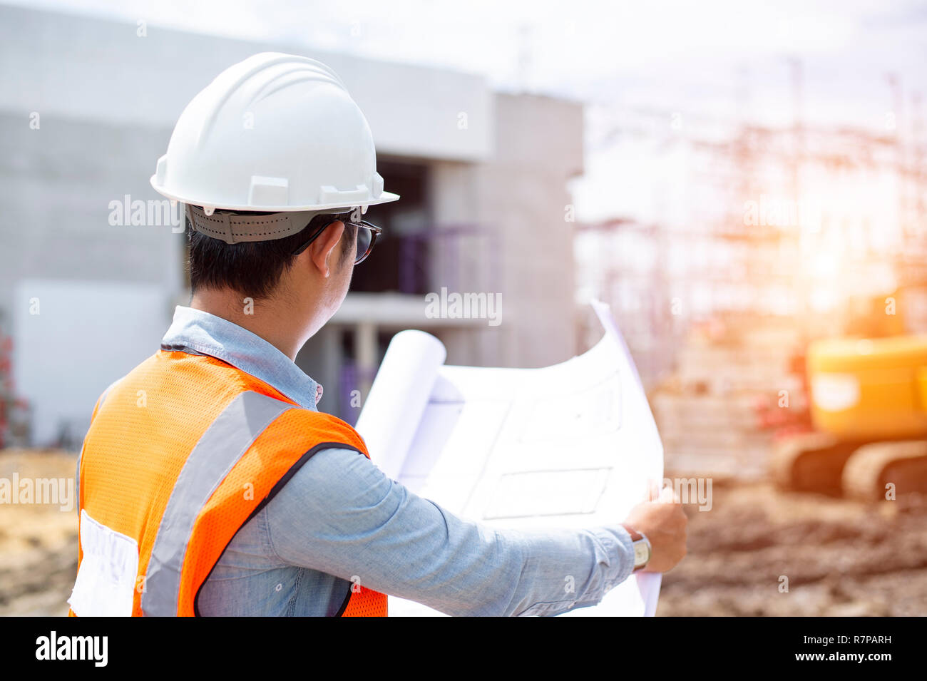Asian architect or civil engineer at the construction site. Stock Photo