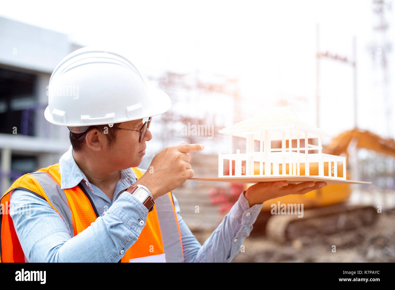 Asian engineer architects working on new architectural house model
