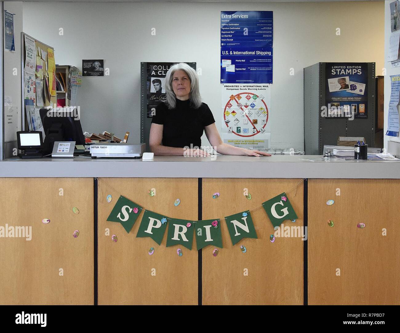 Sharon McCrea, Malmstrom Air Force Base postmaster, poses at the