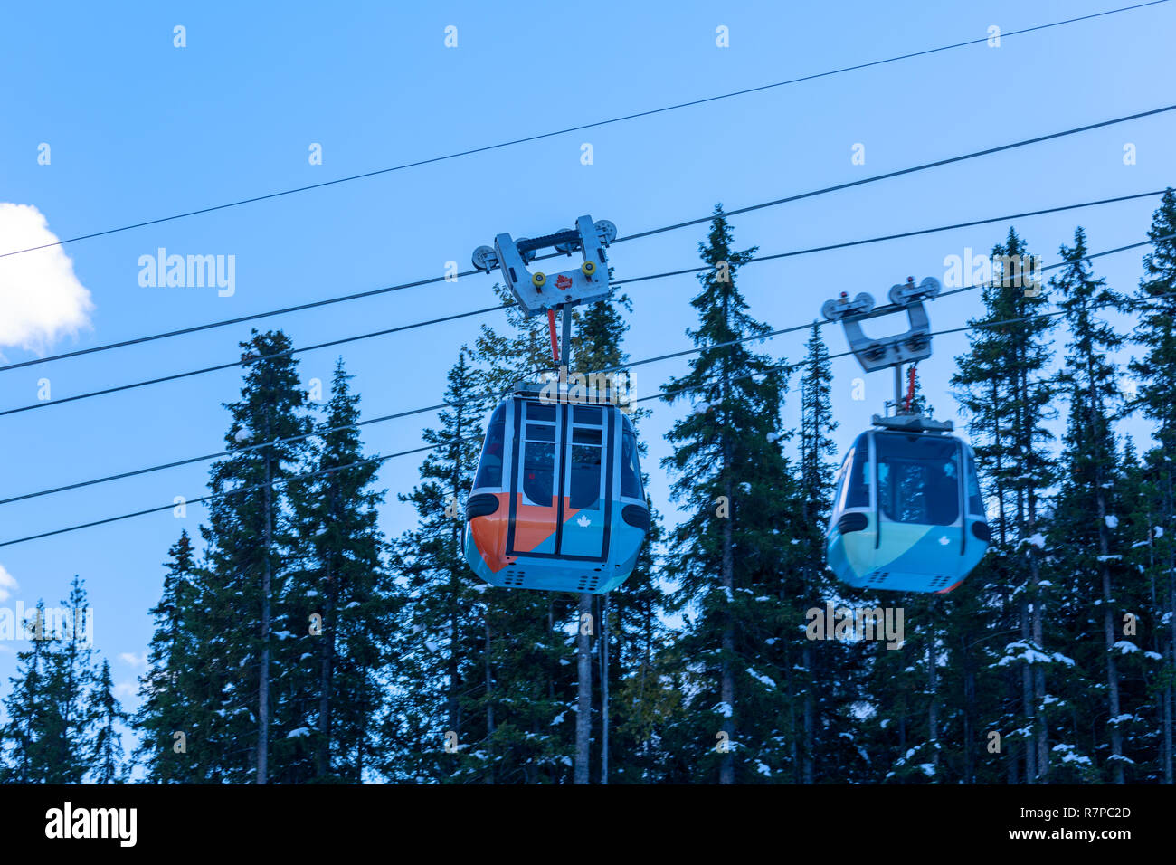 Alberta, Canada - October 7, 2018 : Cable car gondolas travelling up and down Sulphur Mountain in Banff Stock Photo
