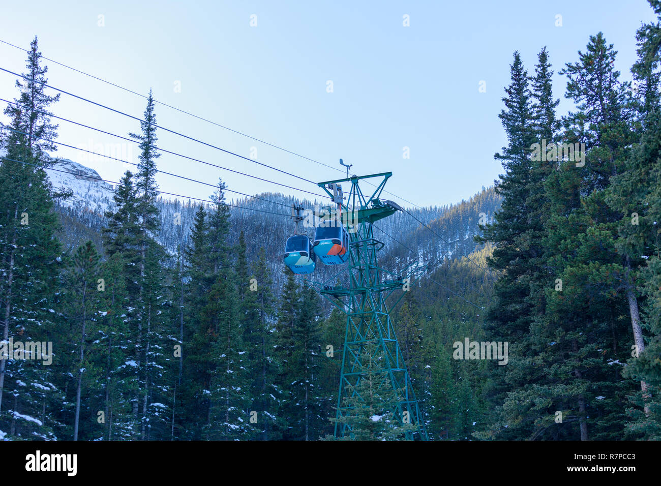 Alberta, Canada - October 7, 2018 : Cable car gondolas travelling up and down Sulphur Mountain in Banff Stock Photo