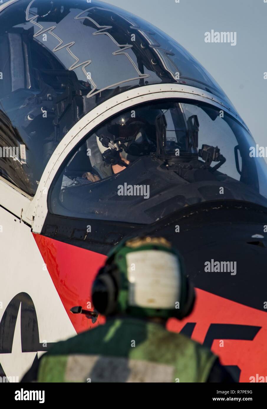 ATLANTIC OCEAN (March 20, 2017) A pilot taxis a T-45C Goshawk assigned to Carrier Training Wing (CTW) 1 across the flight deck of the aircraft carrier USS Dwight D. Eisenhower (CVN 69) (Ike). Ike is currently conducting aircraft carrier qualifications during the sustainment phase of the Optimized Fleet Response Plan (OFRP). Stock Photo