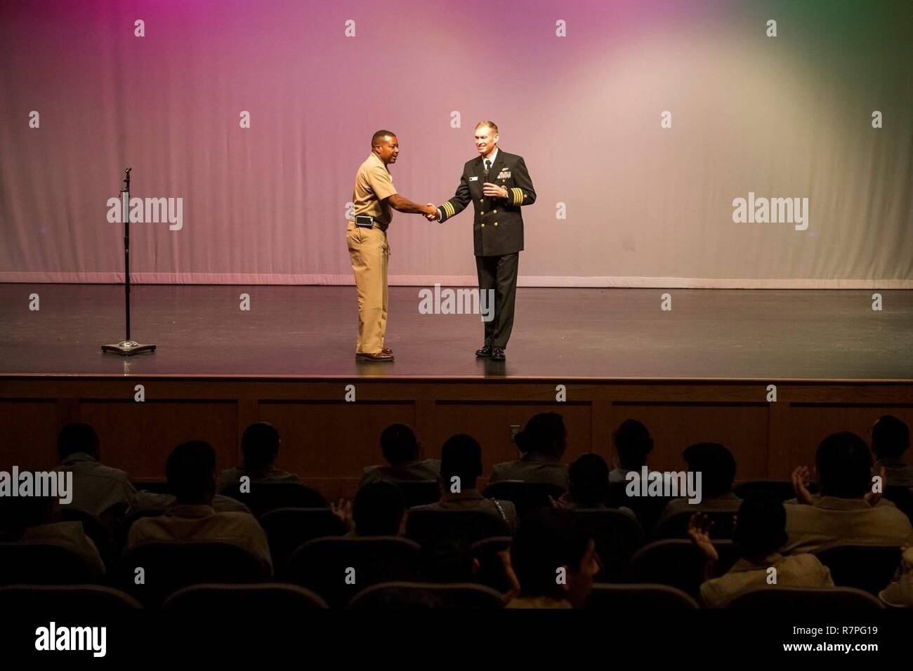 AUSTIN, Texas (March 22, 2017) Capt. Cassidy Norman, Executive Officer aircraft carrier USS Harry S. Truman (CVN 75), speaks at Travis High School during Navy Week Austin. Navy Week programs serve as the Navy's principal outreach effort in areas of the country without a significant Navy presence. Stock Photo