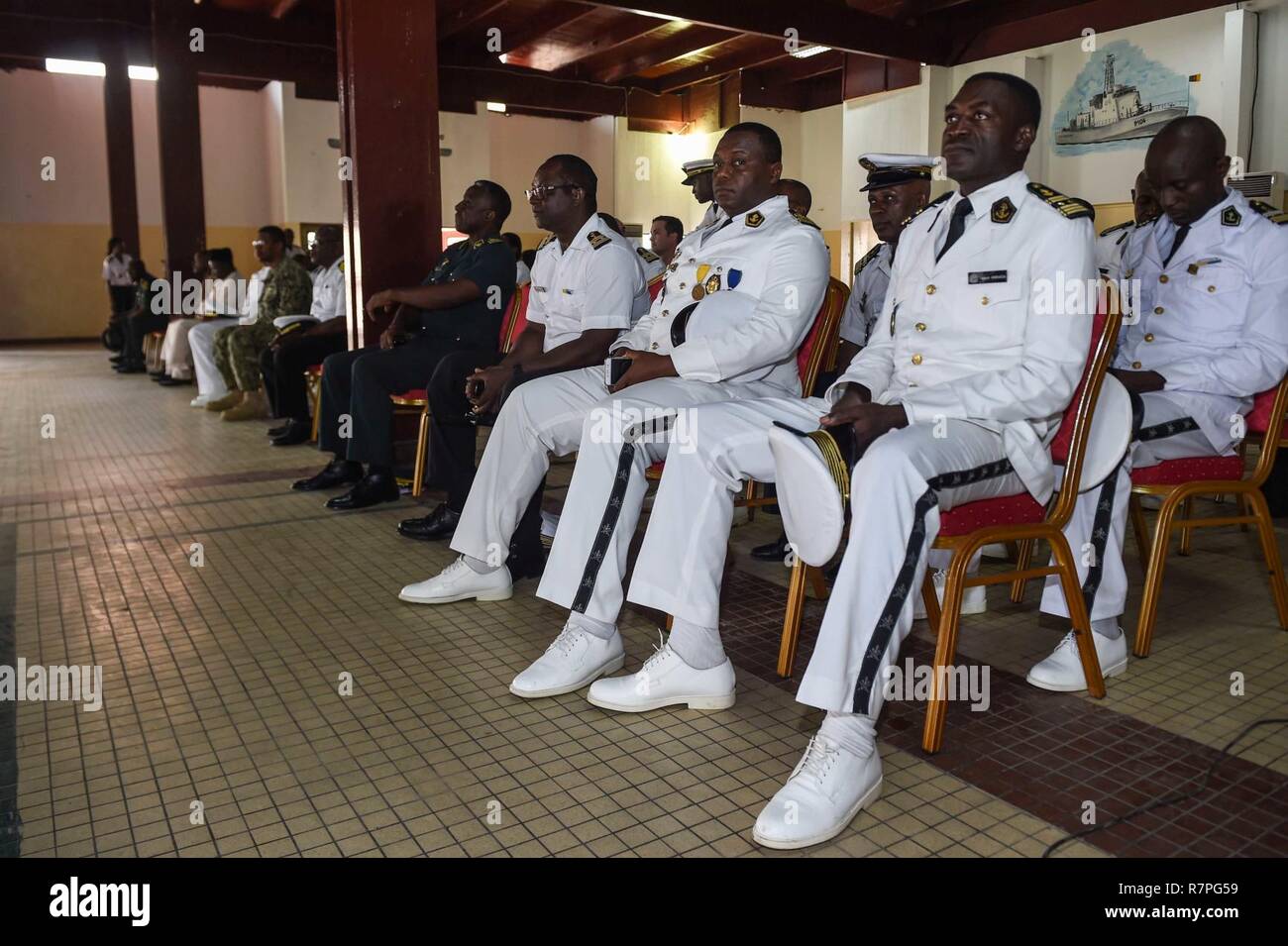 DOUALA, Cameroon (March 23, 2017) African partnership Sailors attend the Douala, Cameroon, opening ceremonies for Obangame Express 2017, March 23. Obangame Express, sponsored by U.S. Africa Command, is designed to improve regional cooperation, maritime domain awareness, information-sharing practices, and tactical interdiction expertise to enhance the collective capabilities of Gulf of Guinea and West African nations to counter sea-based illicit activity. Stock Photo