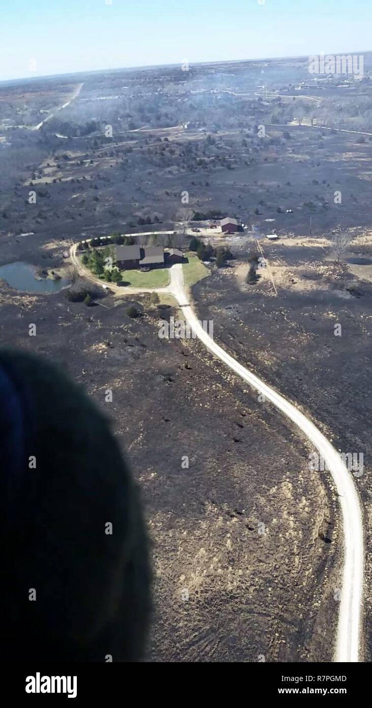 The Kansas National Guard dropped 482 Bambi buckets of water from Black Hawk helicopters, which equals approximately 289,200 gallons of water on a series of wildland fires across the state of Kansas in March 2017. Stock Photo