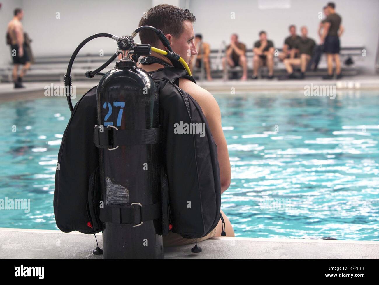 Sgt. Ryan Williams prepares to dive into the pool with a self-contained underwater breathing apparatus during a battalion training event at Camp Lejeune, N.C., March 23, 2017. The training helped Marines enhance their ability to operate in real-world scenarios with scuba gear. Williams is a reconnaissance Marine with 2nd Reconnaissance Battalion, 2nd Marine Division. Stock Photo