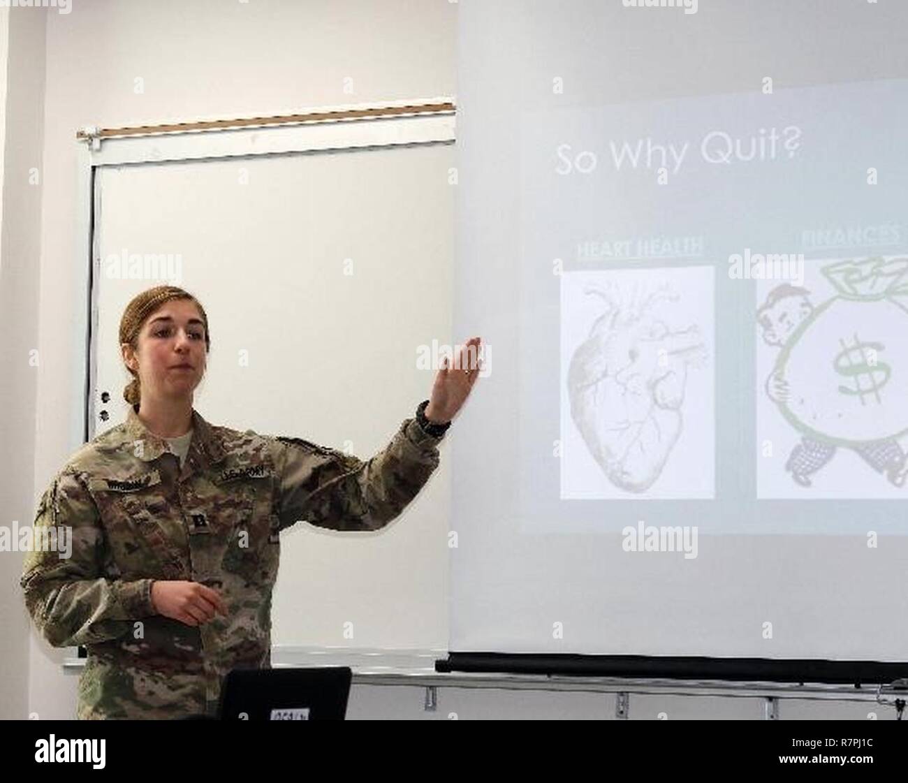 Army Capt. Kira Brown, a dietitian attached to 31st Combat Support Hospital, gives a presentation emphasizing the importance of nutrition when one stops smoking, March 24, Camp Arifjan, Kuwait. Soldiers participating in the Tobacco Cessation Program are asked to participate in four classroom sessions which emphasize the value of being smoke free to the individual’s mind and body. Stock Photo