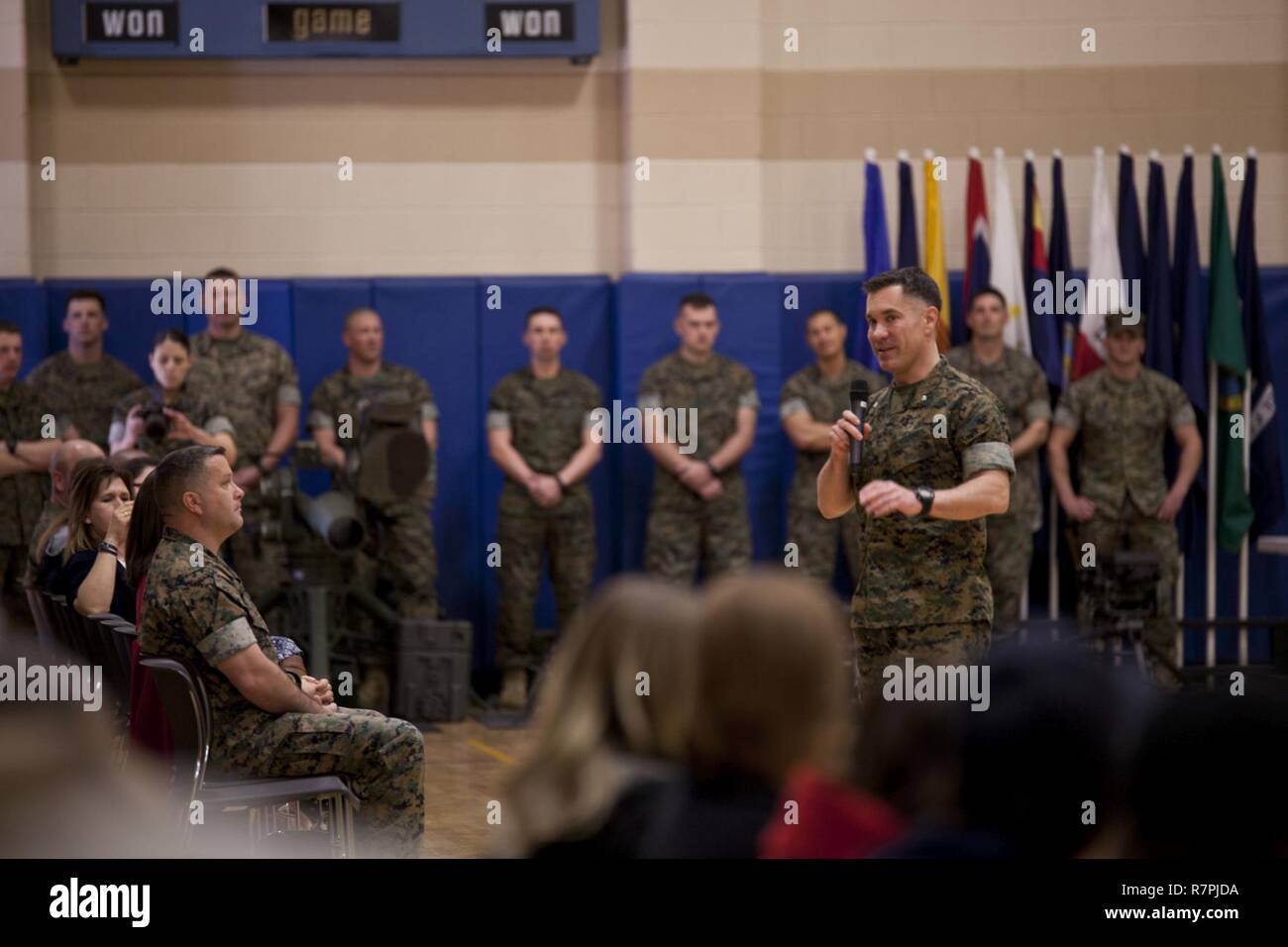 U.S. Marine Corps Lt. Col. Brett T. McGinley, commanding officer of Infantry Training Battalion, School of Infantry-East, addresses guests during the Bravo Company graduation aboard Camp Geiger, N.C., March 23, 2017. Lt. Col. McGinley spoke to the friends and families of the Marines who graduated that day. Stock Photo
