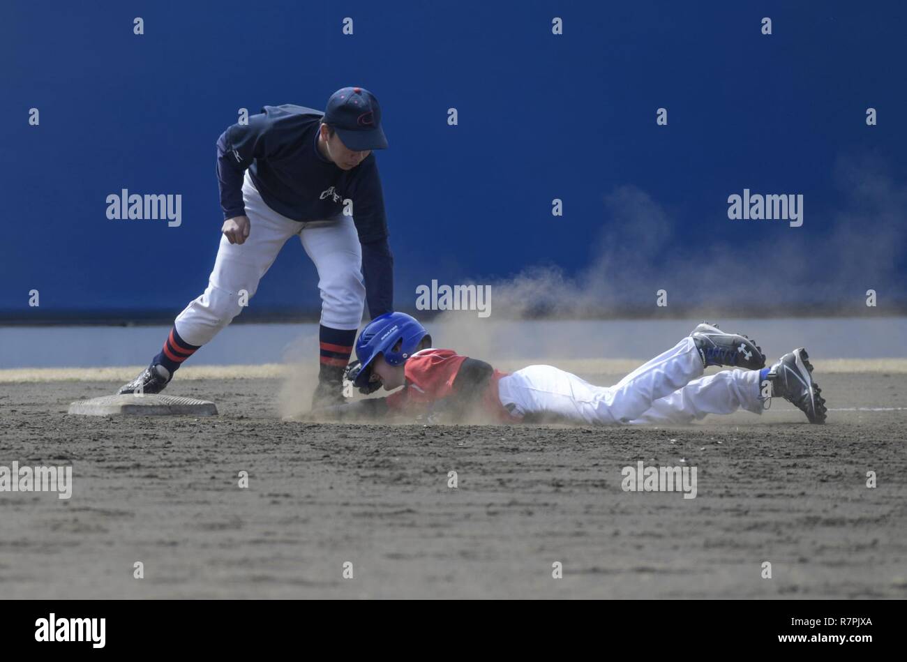 A Player From The Yokota Samurai Baseball Team Is Tagged Out While Sliding Into Third Base During The Inaugural Japan Us Friendship Youth Baseball Game At Yokota Air Base Japan March 25 2017