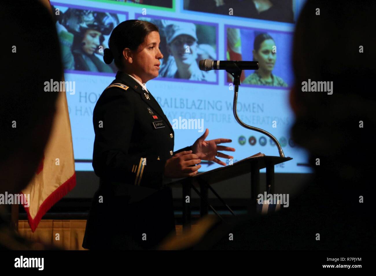 Lt. Col. Jennifer Chapman, 3rd Infantry Division senior intelligence officer, speaks about the contributions of female servicemembers during a Women’s History Month observance March 22, 2017 at Fort Stewart, Ga. This year’s theme was “Honoring trailblazing women.” Stock Photo