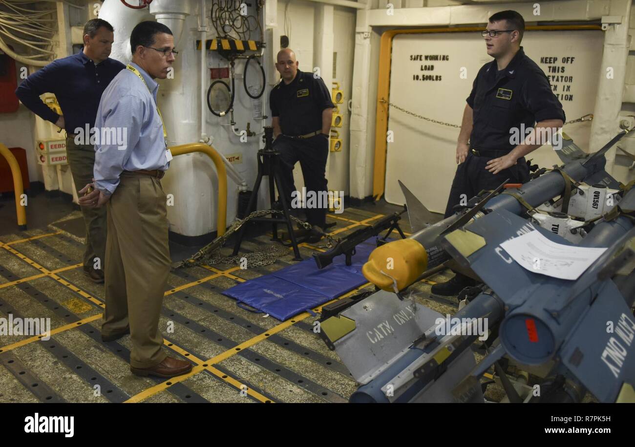 PACIFIC OCEAN (March 26, 2017) Congressman Anthony Brown (D-MD), tours a weapons magazine during a visit to the aircraft carrier USS Nimitz (CVN 68). Nimitz is currently underway conducting Composite Training Unit Exercise (COMPTUEX) with the Nimitz Carrier Strike in preparation for an upcoming deployment. COMPTUEX tests a carrier strike group's mission-readiness and ability to perform as an integrated unit through simulated real-world scenarios. Stock Photo