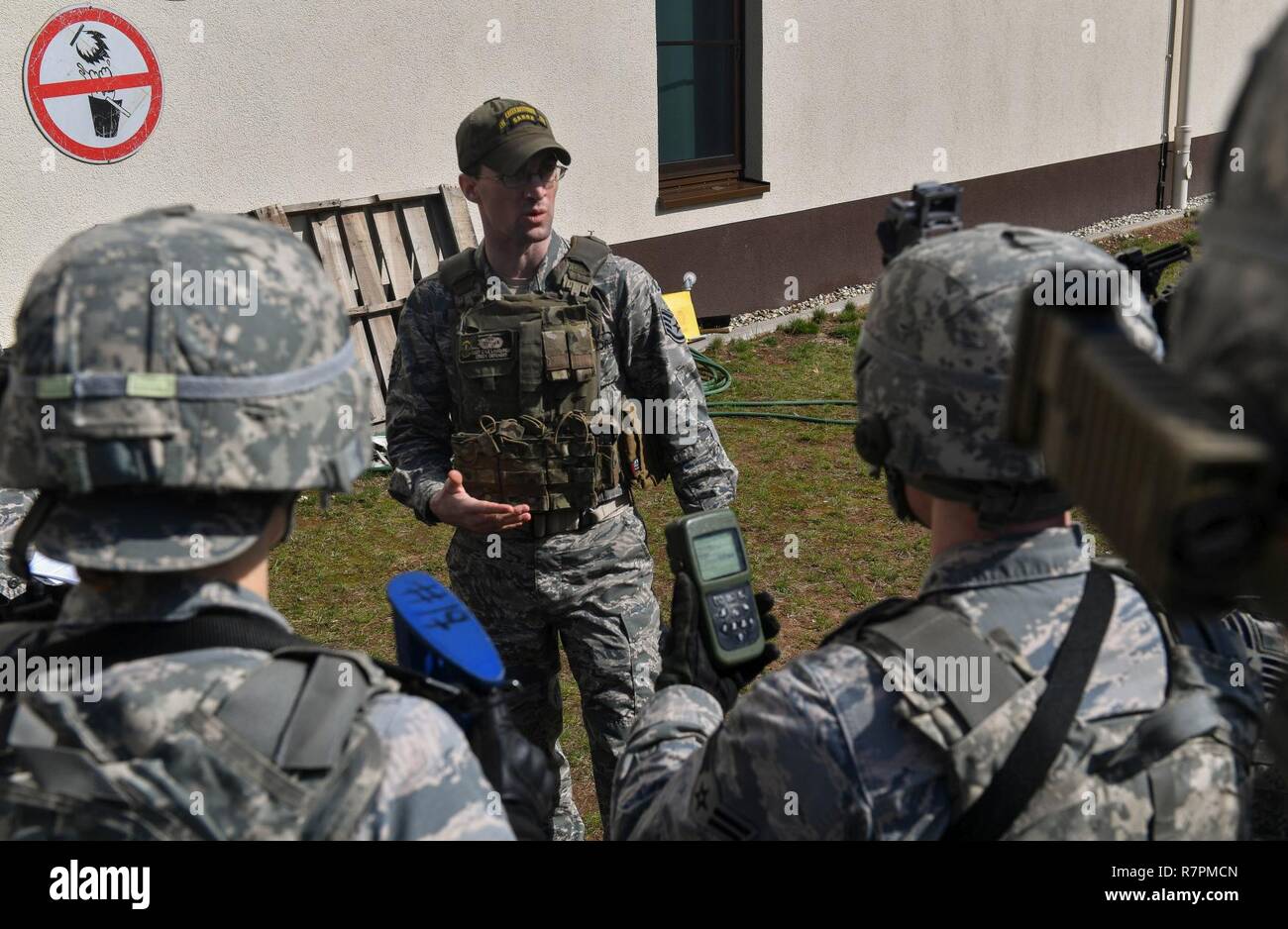 Staff Sgt. Cyle Lamoureux, 435th Security Forces Squadron Ground Combat Readiness Training Center instructor, briefs students on how to use a defense advanced GPS receiver during the DAGR training portion of the Security Operations Course on Ramstein Air Base, Germany, March 25. 2017. The two-week course began March 24 and provides pre-deployment training to security forces Airmen who will be going downrange Airmen assigned to the 86th SFS, 422nd SFS, 100th SFS, and 569th U.S. Forces Police Squadron participated in the course. Stock Photo