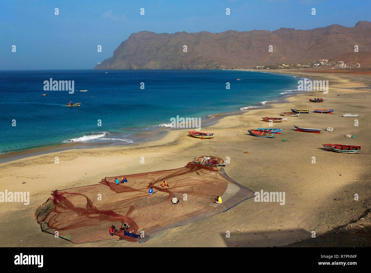 Cape Verde, Sao Vicente, Sao Pedro, Fishermen putting their nets and boats beached on the beach of Sao Pedro Stock Photo