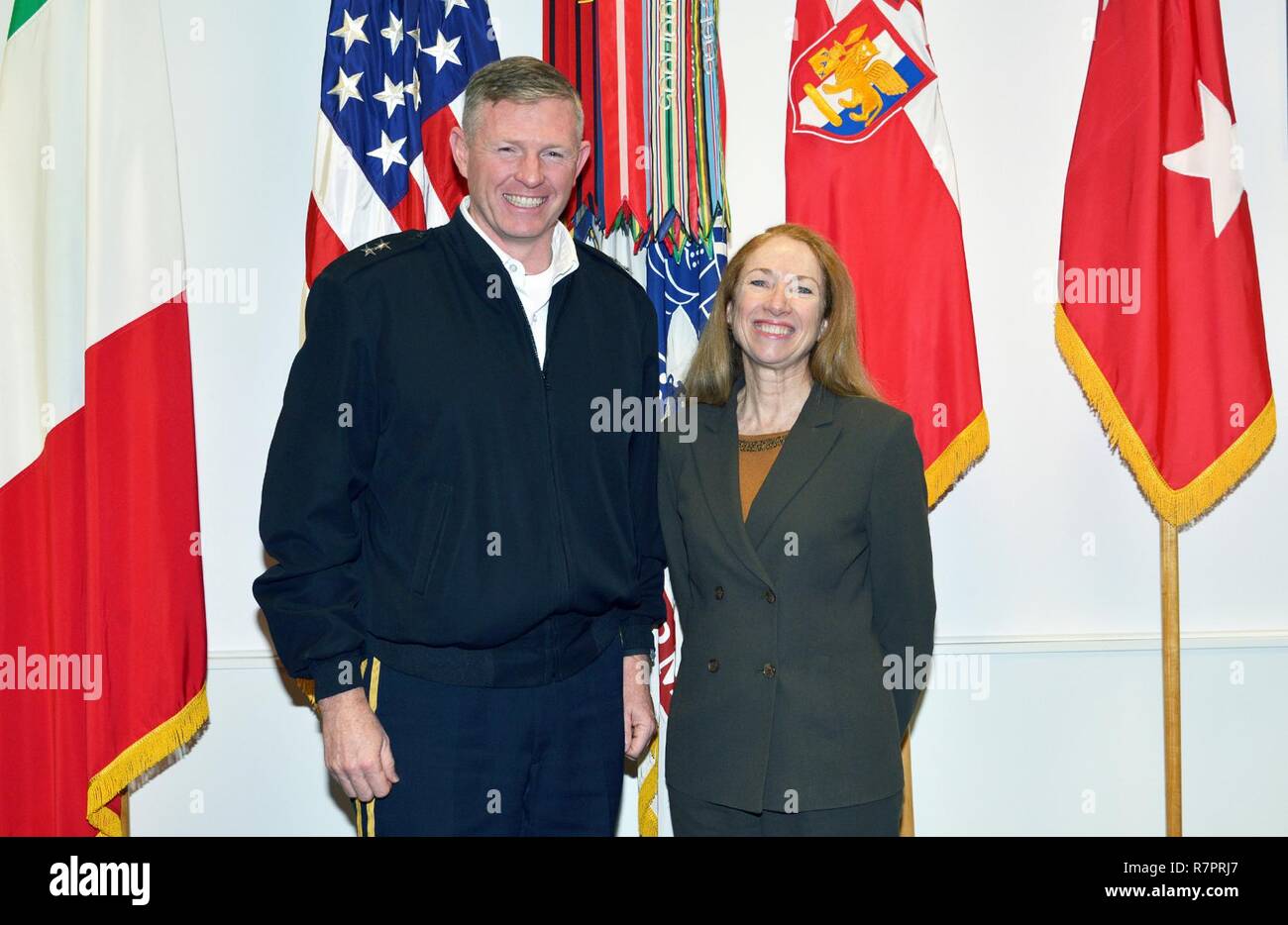 From left, Maj. Gen. Joseph P. Harrington, U.S. Army Africa Commanding General, Hon. Kelly Degnan, charge’ d’Affaires ad interim U.S. Embassy & Consulates Italy, pose for a photo in the USARAF Commander's office at Caserma Ederle in Vicenza, Italy, March 29, 2017. Stock Photo