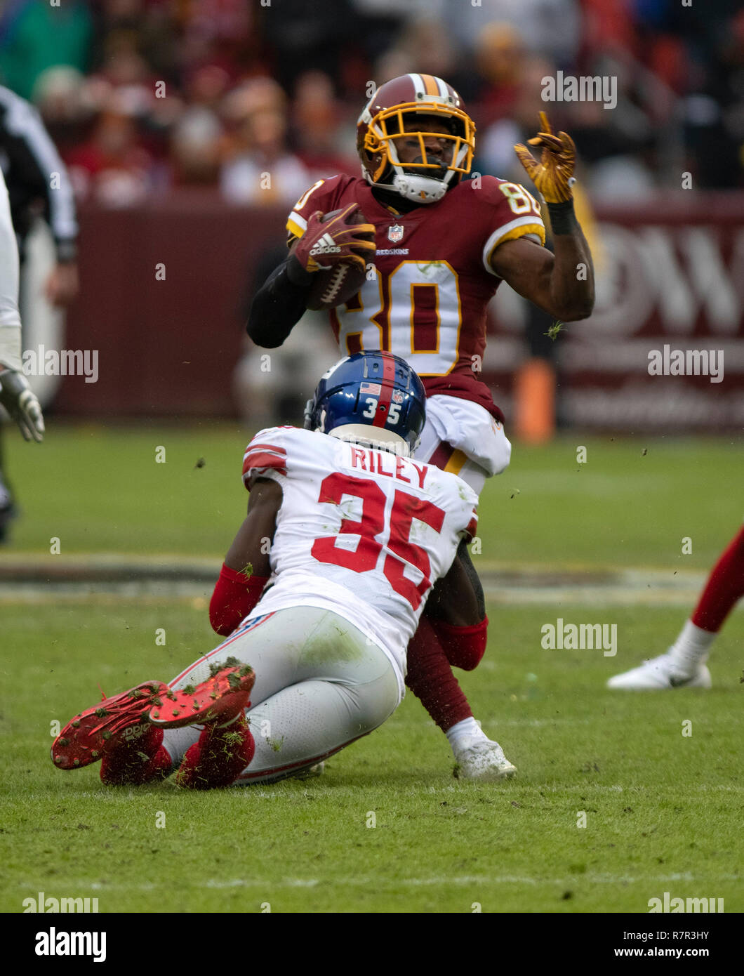 New York Giants free safety Curtis Riley (35) tackles against the Washington RedskinsWashington Redskins wide receiver Jamison Crowder (80) in second quarter action Landover, Maryland on Sunday, December 9, 2018. Credit: Ron Sachs/CNP (RESTRICTION: NO New York or New Jersey Newspapers or newspapers within a 75 mile radius of New York City) | usage worldwide Stock Photo