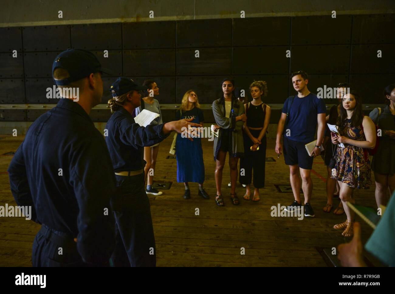 MAYPORT, Fla. (March 29, 2017) - Ens. Kimberly King leads students from the Department of Geography at University College London on a tour of the amphibious assault ship USS Iwo Jima (LHD 7). Iwo Jima recently returned to her homeport after conducting a series of certifications and qualifications in preparation for future deployments. Stock Photo