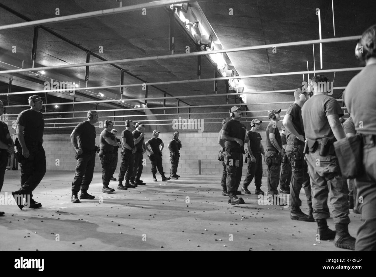 Coast Guard crewmembers prepare to conduct a live fire exercise during